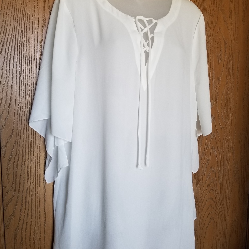 White blouse tie frontat neck. Light & airy.